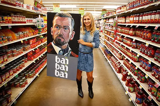 Rachel Dawn Renaudin poses with her Justin Timberlake-inspired artwork at the Giant Eagle Market District in Shadyside. - CP PHOTO: JARED WICKERHAM