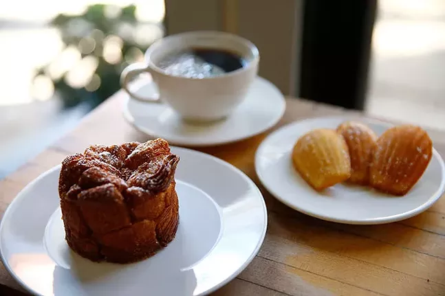 A chai-spiced pull-apart bread, madeleines, and a coffee at Madeleine Bakery & Bistro - CP PHOTO: JARED WICKERHAM