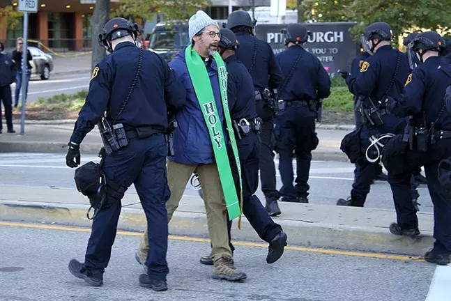 Pittsburgh Police arrest a demonstrator for unlawful protesting during the Solidarity Against White Nationalism rally on Wed., Oct. 23, 2019. - CP PHOTO: JOIE KNOUSE