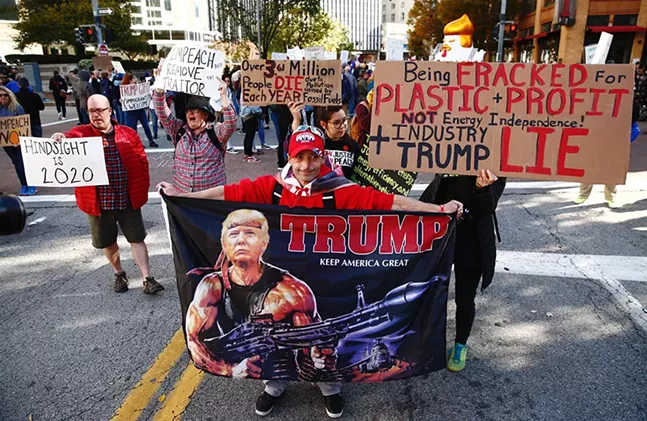 Supporters and protesters gathered in Downtown Pittsburgh during President Trump's visit to the David L. Lawrence Convention Center on Wed., Oct. 23. - CP PHOTO: JARED WICKERHAM