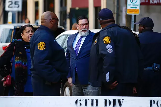 Pittsburgh mayor Bill Peduto speaks to police and protest organizers outside the convention center. - CP PHOTO: JARED WICKERHAM