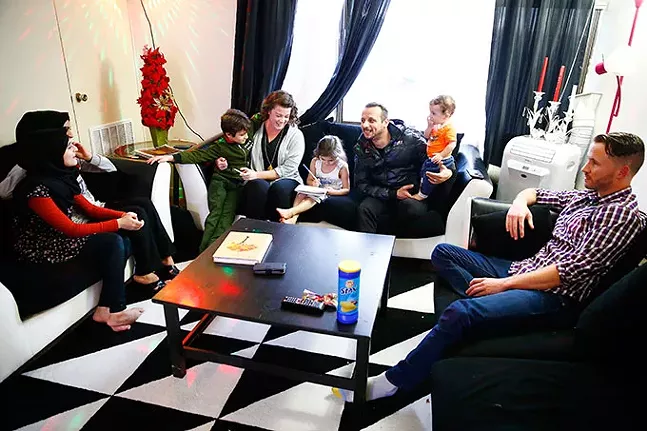The Knaineh family with Hello Neighbor mentors Clare Wardwell and Ken Hornfeck - CP PHOTO: JARED WICKERHAM