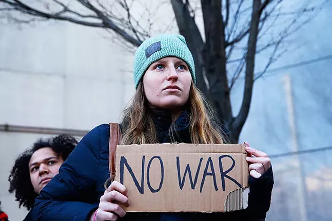 An anti-war protest put on by the Pittsburgh Anti-Imperialism Committee outside the Federal Building in Downtown Pittsburgh on Mon., Jan. 6 - CP PHOTO: JARED WICKERHAM