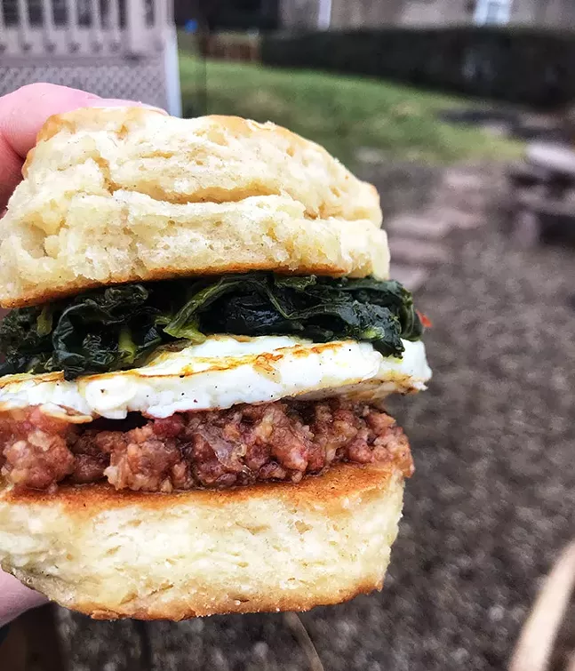 Biscuit from Wise County Biscuits with greens, egg, and bacon jam - PHOTO: COURTESY OF WISE COUNTY BISCUITS