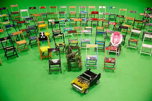 Various parking chairs made by Pittsburgh artists, showcased as part of VisitPittsburgh’s “Pull Up a Chair” campaign - CP PHOTO: JARED WICKERHAM