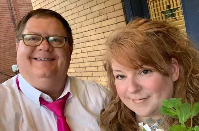 Allison Ruppert (right) and Rob Conroy (left) during their porch wedding on Monday night. - PHOTO: ALLISON RUPPERT AND ROB CONROY