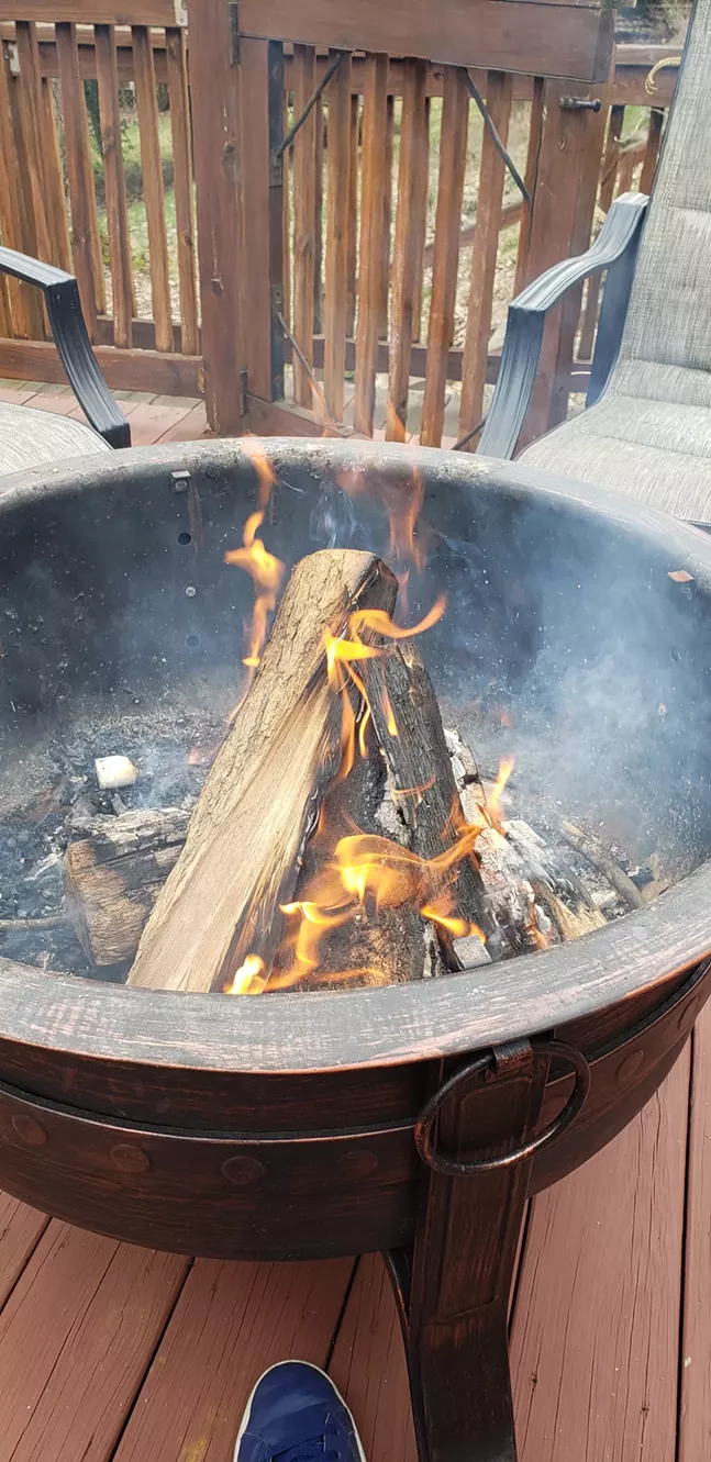Family fire pit photo complete with fallen-soldier marshmallow and discount shoes. - CP PHOTO: JOSH OSWALD