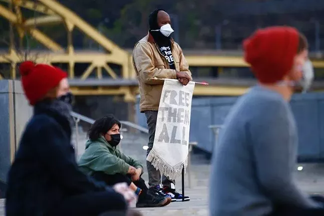 A vigil for inmates who have died at Allegheny County Jail was held at Point State Park on Sun., April 19. - CP PHOTO: JARED WICKERHAM
