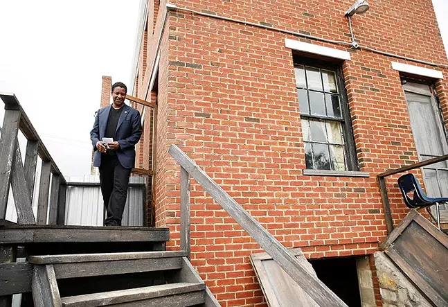 Denzel Washington, who starred in Pittsburgh playwright August Wilson's Fences Broadway play in 2010 and movie adaptation in 2016, took part in a community groundblessing at the August Wilson House in the Hill District on Wed., Sept. 26, 2018. - CP PHOTO: JARED WICKERHAM
