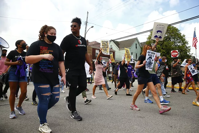 Zach Banner of the Pittsburgh Steelers attends the protest with his sister. - CP PHOTO: JARED WICKERHAM