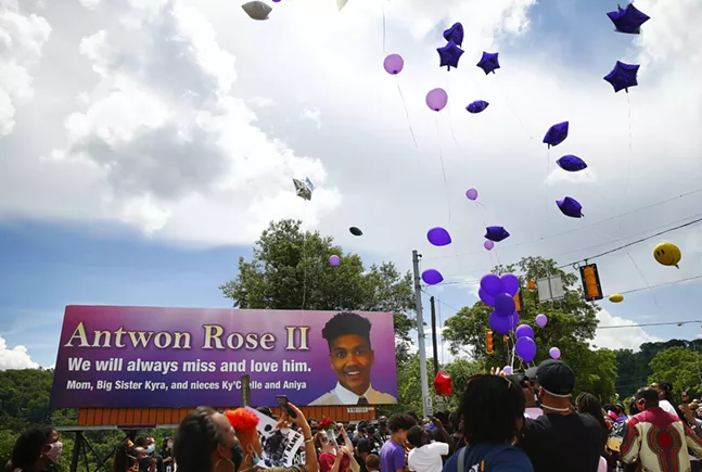 Balloons are released by family members of Antwon Rose II in memory of him in front of the billboard along Route 30 in East Pittsburgh. - CP PHOTO: JARED WICKERHAM