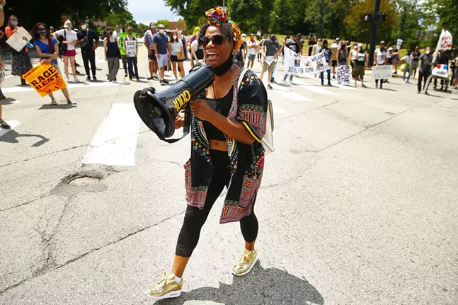 State Representative Summer Lee speaks to the crowd while circled up at Penn and Fifth avenues. - CP PHOTO: JARED WICKERHAM