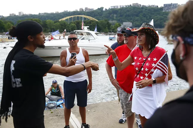 Pittsburgh activist Lorenzo Rulli speaks to a group of pro-Trump supporters on the North Shore. - CP PHOTO: JARED WICKERHAM