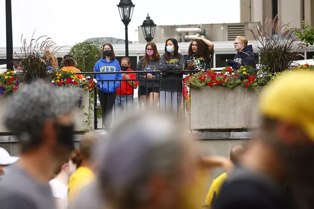 University of Pittsburgh students look on after recently moving into their dorms. - CP PHOTO: JARED WICKERHAM