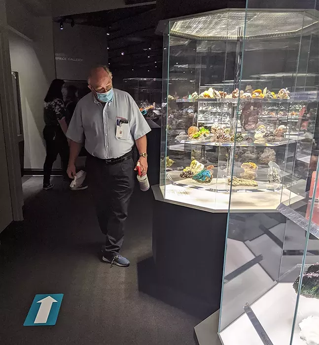 A staff member wipes down surfaces in the Hillman Hall of Minerals and Gems at the Carnegie Museum of Natural History. - CP PHOTO: AMANDA WALTZ