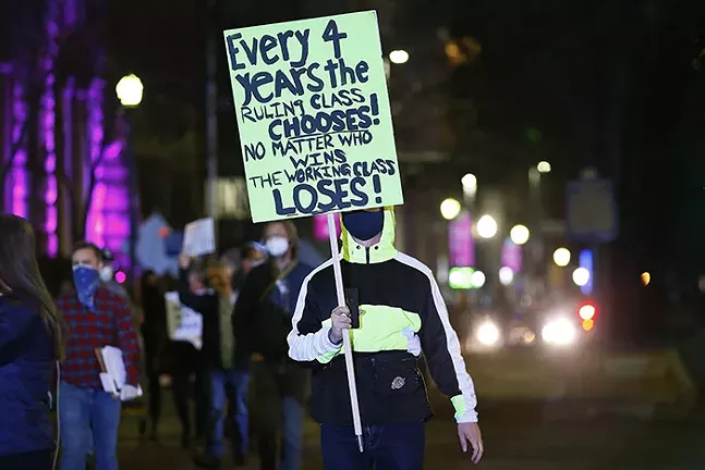 A protester carries a sign during a “Don’t let Trump steal the election” rally in Downtown Pittsburgh on Wed., Nov. 4. - CP PHOTO: JARED WICKERHAM