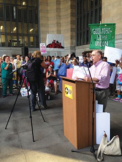 Barney Oursler, of Pittsburgh United, leads a rally for fair pay and unionization for hospital workers. - PHOTO BY RYAN DETO