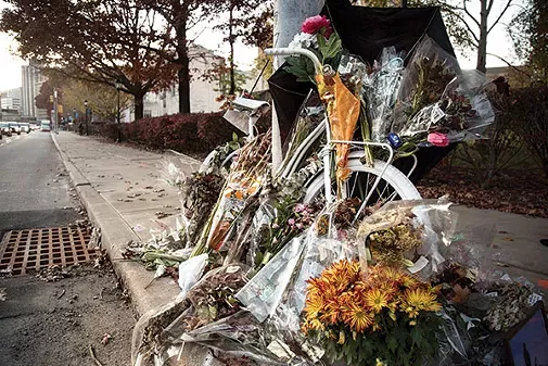 A ghost bike marking the spot on Forbes Avenue where cyclist Susan Hicks was killed. - PHOTO BY THEO SCHWARZ