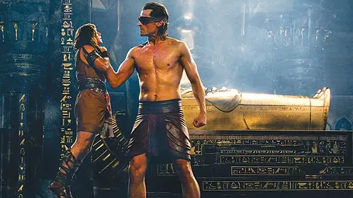 “Mortal, look upon my burnished pecs!” Bek (Brenton Thwaites) is schooled by Horus (Nikolaj Coster-Waldau)