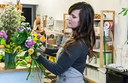 The Farmer's Daughter Flowers' owner Lauren Work Phillips creates a bridal bouquet - PHOTO BY AARON WARNICK