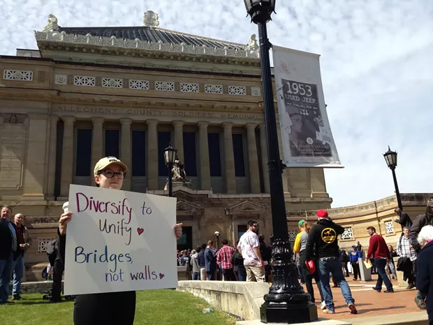 Ellen Connally from Greenfield protests presidential candidate Donald Trump's visit. - PHOTO BY RYAN DETO