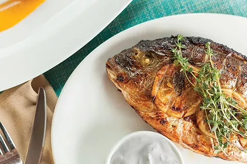 Poros: Tandoor Roasted Dorade with garlic lime yogurt from Poros Aegean Estiatorio - PHOTO BY VANESSA SONG