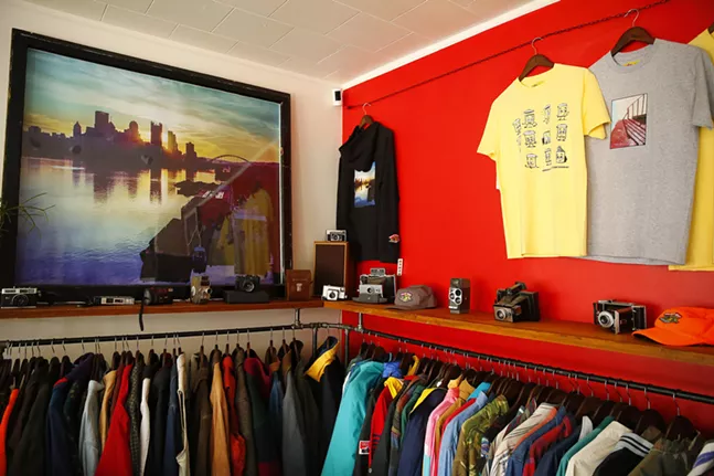 Vintage and custom clothing racks as well as works of art hang on the walls inside Bankrupt Bodega. - CP PHOTO: JARED WICKERHAM