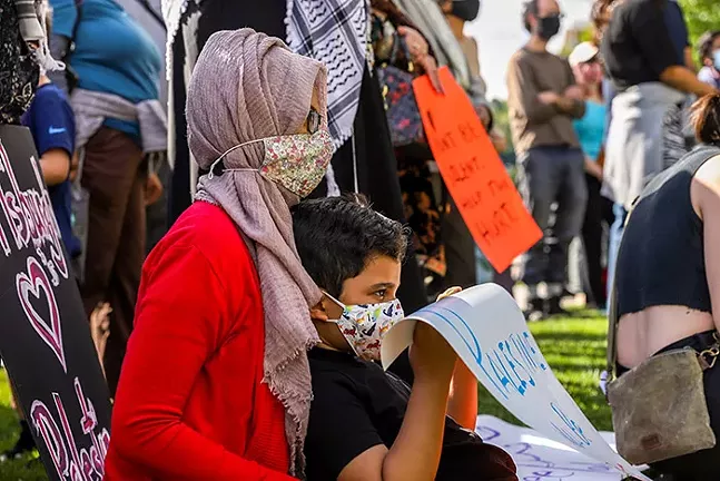 Demonstrators gather for a Stand in Solidarity with Palestine protest outside the Cathedral of Learning in Oakland. - CP PHOTO: KAYCEE ORWIG
