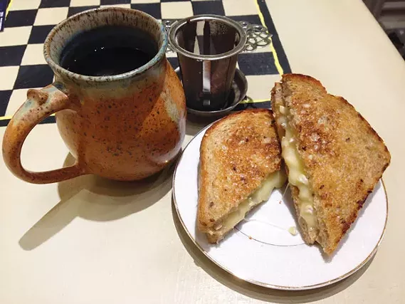 Mug of plum-cinnamon tea and a grilled-cheese sandwich, with brie and pepper jam - CP PHOTO BY RYAN DETO