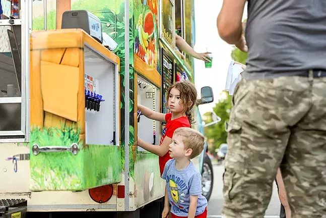 People get Kona Ice in the Dormont Pool parking lot before during the Dormont Day Fourth of July celebration. - CP PHOTO: KAYCEE ORWIG