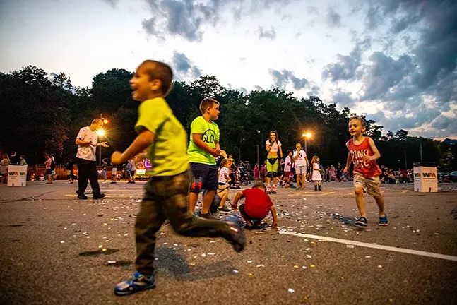 Kids play in the Dormont Pool parking lot before the Dormont Day fireworks during the Fourth of July Celebration. - CP PHOTO: KAYCEE ORWIG