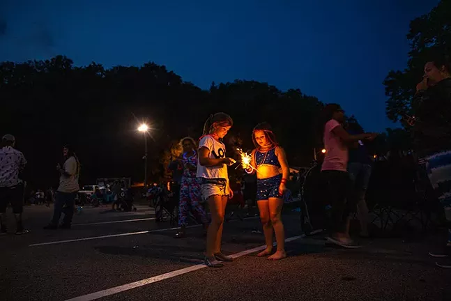 Kids play with sparklers before the Dormont Day fireworks during the Fourth of July Celebration. - CP PHOTO: KAYCEE ORWIG