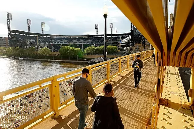 Pittsburgh Pirates fans walk across the Roberto Clemente Bridge on way to PNC Park - CP PHOTO: JARED WICKERHAM