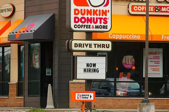 A "Now Hiring" sign is shown at Dunkin’ Donuts along Route 51 on Thu., Aug. 12. - CP PHOTO: JARED WICKERHAM