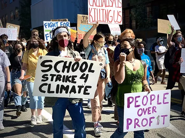 Ilyas Khan (left) and Luna Plaza (right) lead a crowd of about 200 from Oakland to Downtown. - CP PHOTO: KIMBERLY ROONEY