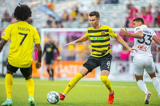 Pittsburgh Riverhounds winger Alex Dixon (left) scored late in an Oct. 10 match, thanks to an overhead kick assist by Tommy Williamson (center). - PHOTO: COURTESY OF PITTSBURGH RIVERHOUNDS