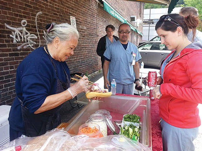 Street food vendor Lucy Nguyen sells ban mi.  - CP PHOTO FILE: Amijo Brown