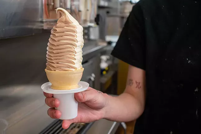 Page’s non-dairy option - - Page’s decided on an oat-based recipe for their non-dairy soft serve after an almond base wasn’t creamy enough and a coconut base was too coconutty, according to owner Marjorie Page Prusia. - When a customer orders Page’s non-dairy, oat-based vanilla soft serve, the worker at the register often asks if it’s due to a preference or an allergy. “We want to keep our customers safe,” Prusia says. “We want them to be fully aware of the potential of cross contamination because we don't want to harm anybody.” - If the oat milk soft serve is coming directly out of the machine into a cone or cup or sundae, Prusia says the risk of cross contamination is pretty low. But if someone with a dairy allergy orders something that requires more processing like a milkshake, the team makes sure to limit the risk of cross-contamination. - “If you tell us it's an allergy at the window, we'll clean and sterilize everything,” Prusia says. - CP PHOTO: PAM SMITH