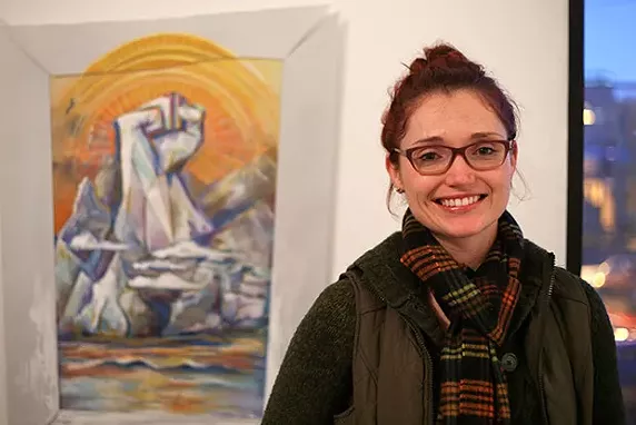 Randi Stewart with her mixed-media painting, part of AIR's Active Voice show - CP PHOTO BY JOHN HAMILTON