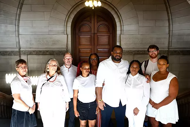 Court watchers wear white at probation hearing to protest judge's conduct