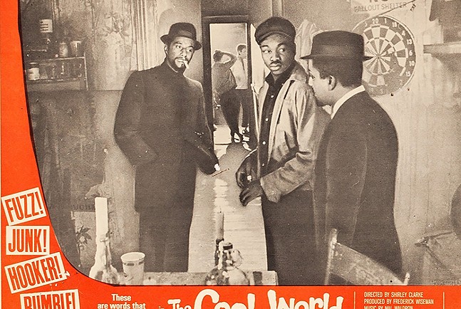 An old, sepia-toned and faded image of three sharply dressed men in hats standing in a room. A dart game hangs on the wall behind them, and one man is smoking a cigarette.