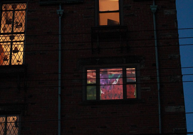 A building at night, where you can see into the windows
