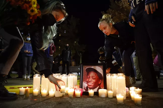 Community members honor Jim Rogers with candlelight vigil on anniversary of his death