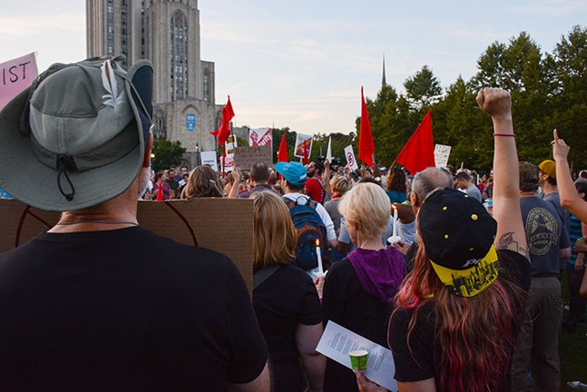 The crowd sang the 19th century socialist anthem “The Red Flag” to the tune of “O Christmas Tree” during a candlelight vigil in Schenley Plaza on Sun., Aug. 13. - CP PHOTO BY STEPHEN CARUSO