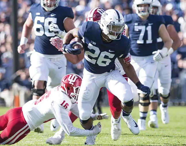Saquon Barkley tries to break a tackle Sept. 30 against Indiana at Penn State’s Beaver Stadium - PHOTO COURTESY OF CAMILLE STEFANI/THE DAILY COLLEGIAN