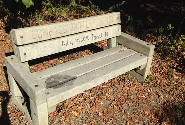 A park bench on the North Side Three Rivers Heritage Trail has been vandalized with the words "Kill Niger Tomlin." - CP PHOTO BY RYAN DETO