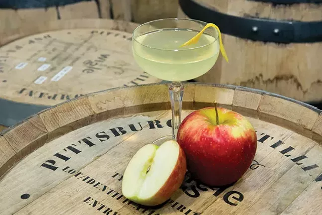 The Good News! cocktail: Threadbare dry cider, Wigle Absent Minded Absinthe, rosemary lavender bitter and orange twist - CP PHOTO BY JOHN COLOMBO