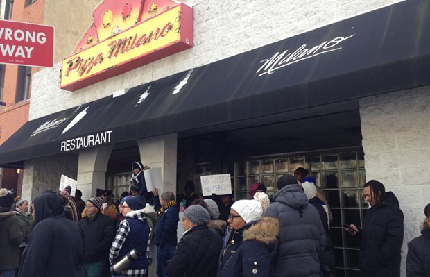 Protesters outside Pizza Milano in Uptown on Jan. 15 - CP PHOTO BY RYAN DETO