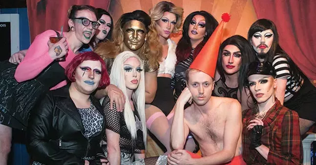 moon baby (in red) poses with drag queens at Blue Moon, where they regularly perform - CP PHOTO BY JOHN COLOMBO