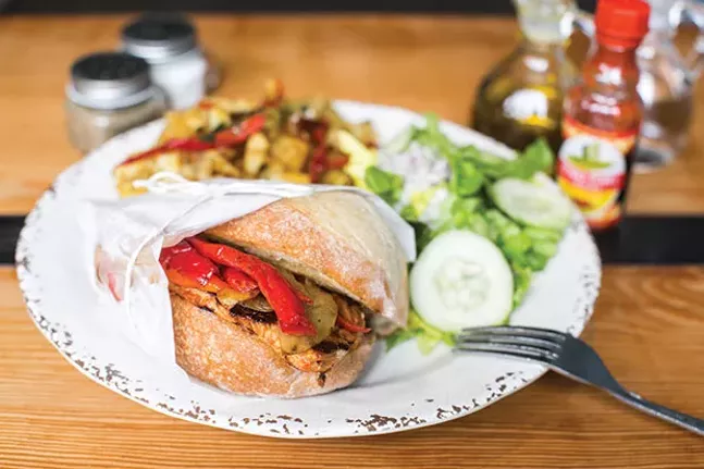 Bifana: pork loin with sautéed onions, lettuce and tomato in a garlic sauce on a Portuguese roll; served with imported peppers, Portuguese salad and home fries - CP PHOTO BY JOHN COLOMBO